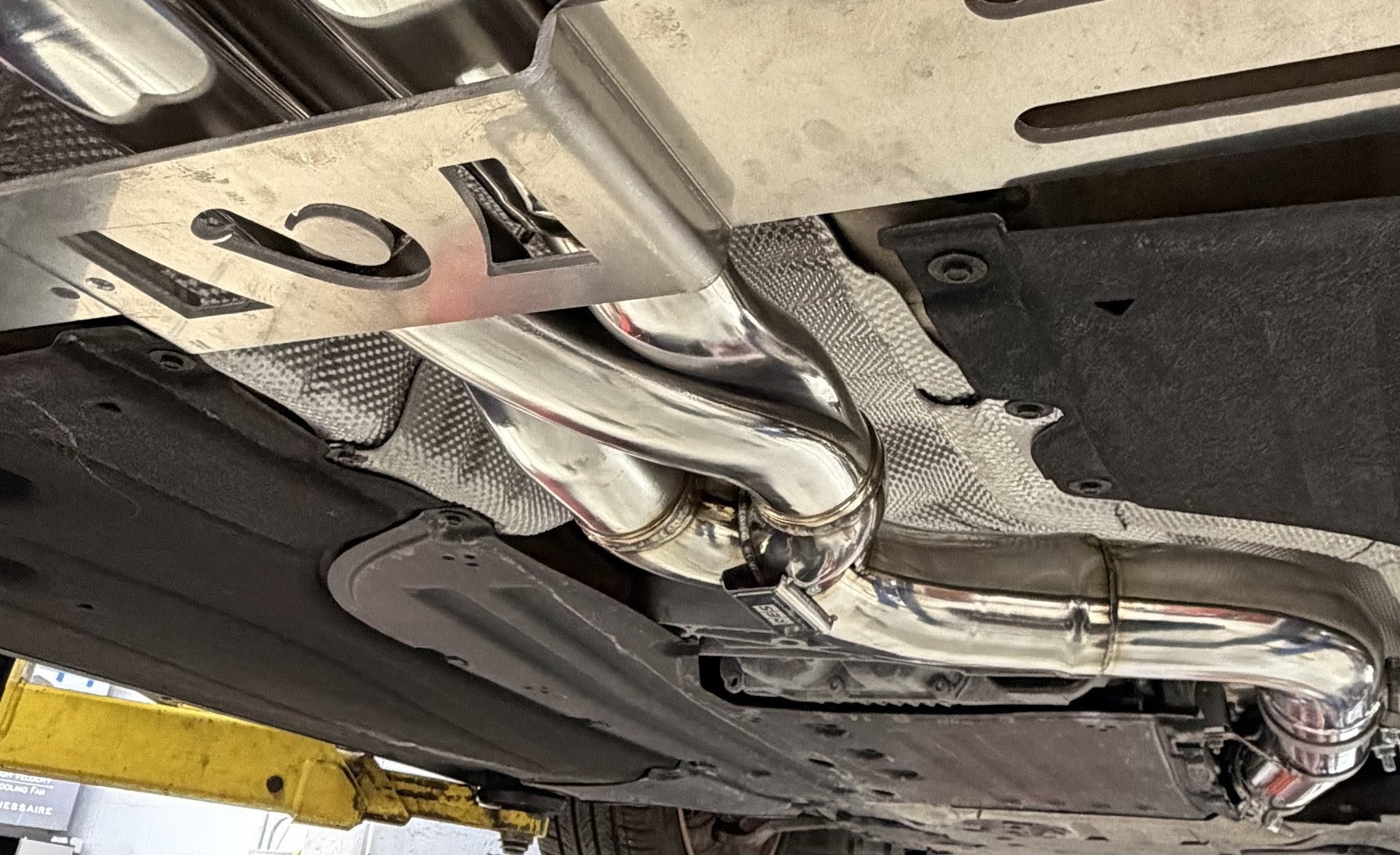 DV-001 undercar — RES Z-pipe midsection installed, polished stainless routing