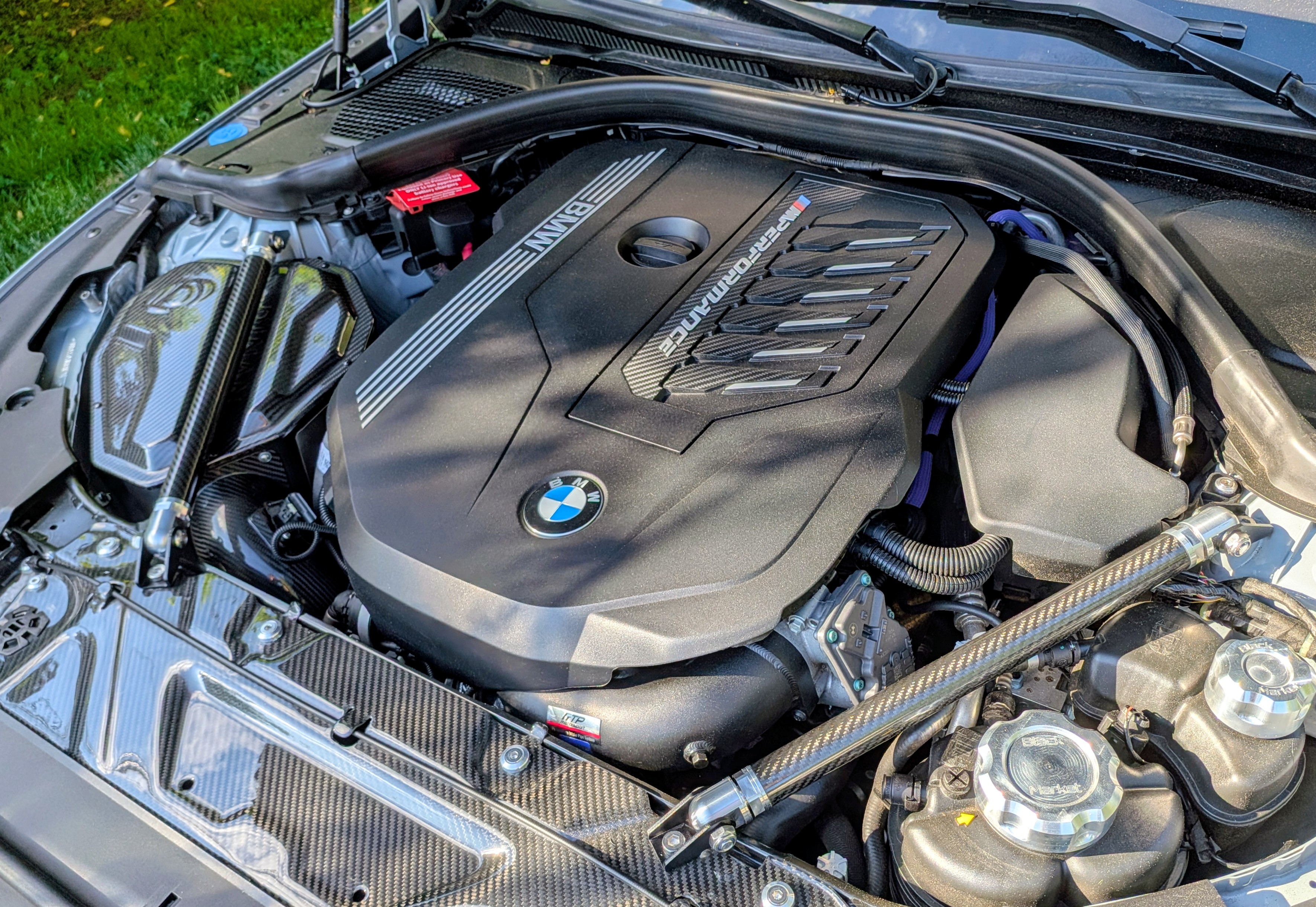 DV-001 engine bay — B58 Gen 2 with full carbon dress-up