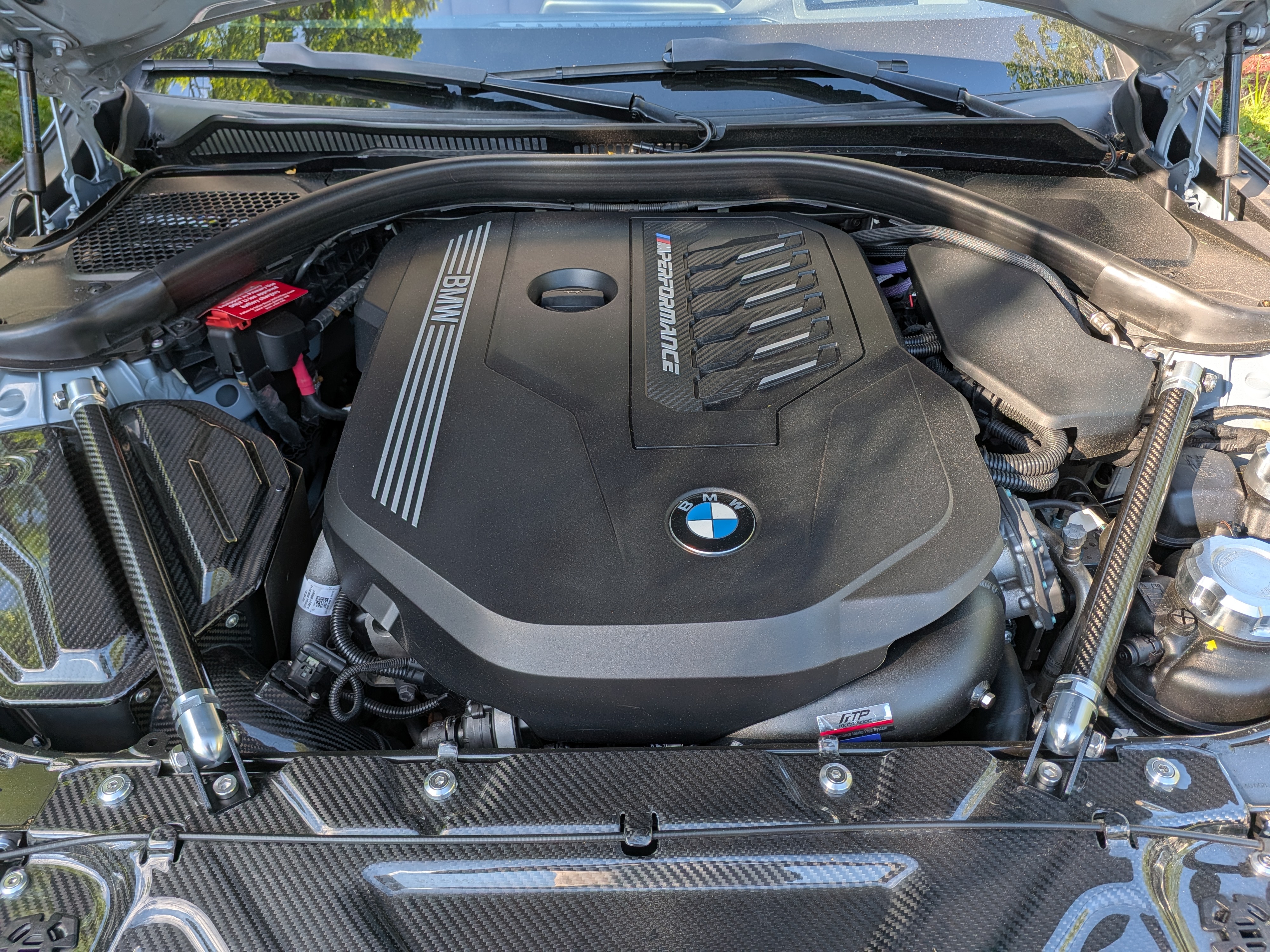 DV-001 engine bay — B58 M Performance cover, carbon strut brace, carbon engine cover